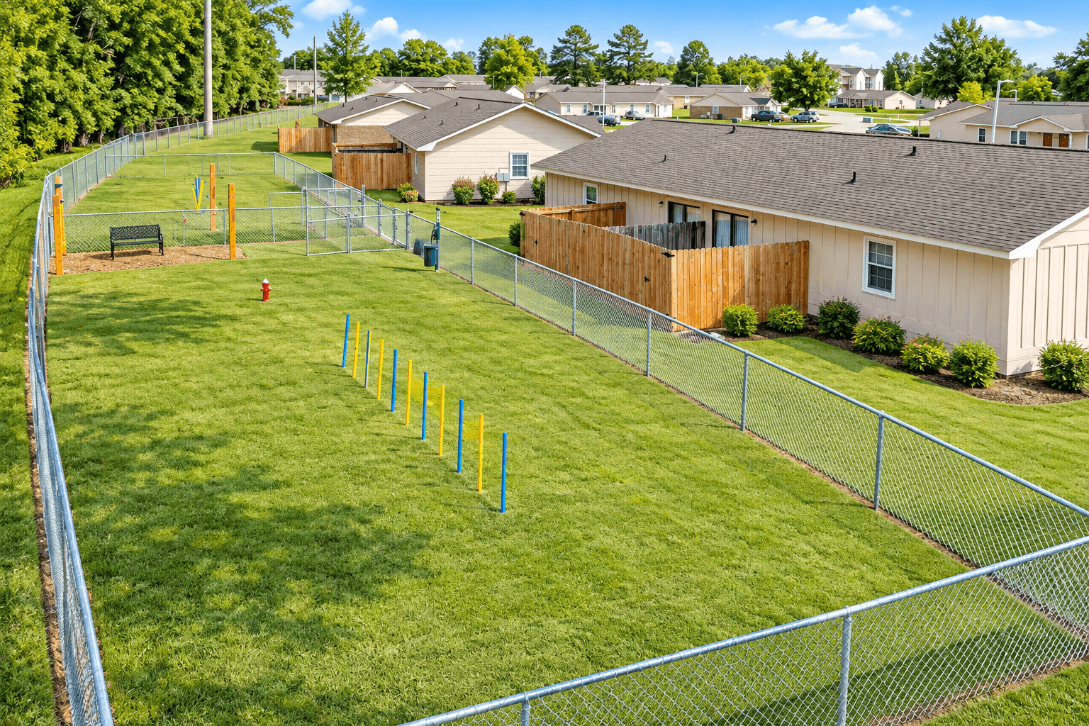 A residential area with houses and a fence.
